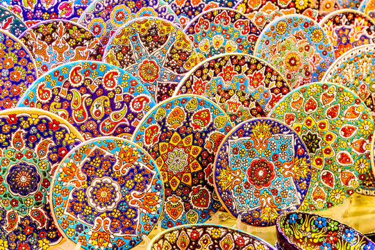 Traditional arabic colorful ceramic plates at Dubai Market souk, United Arab Emirates.