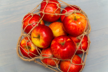 Eco-friendly jute rope mesh bag with apples