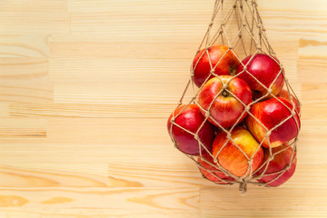 Eco-friendly jute rope mesh bag with apples