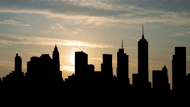 Brooklyn Skyline at Sunrise, Time Lapse with Silhouette of Skyscrapers and Colorful Clodus, Manhattan, New York , USA