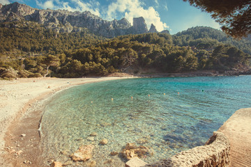 Beach with turquoise water and rocks