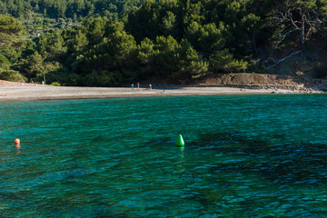 Beach with turquoise water and rocks