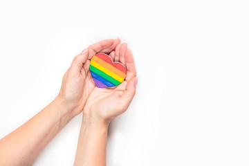 concept of gay pride, LGBT. Hand making heart sign with LGBT gay pride, heart with a rainbow flag