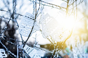 Christmas decorations on wooden background . mittens winter ornament 