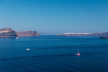 Yachts and sailing boats on the Aegean Sea in the Greek Islands near Santorini Island