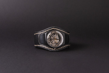 Handmade watch with a rough strap made of genuine black leather.