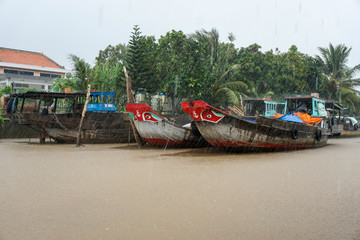 colorful boats in Vietnam, rain