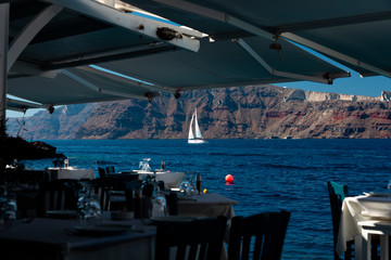 Yachts and sailing boats on the Aegean Sea in the Greek Islands near Santorini Island