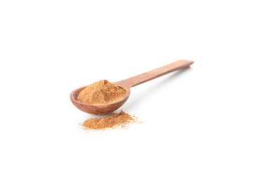 Wooden spoon with cinnamon powder isolated on white background