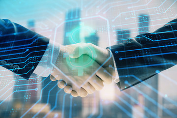 Double exposure of business theme drawing on cityscape background with handshake. Concept of partnership