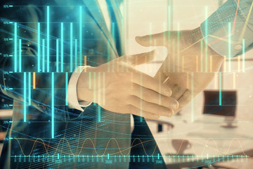 Multi exposure of financial graph on office background with two businessmen handshake. Concept of success in business