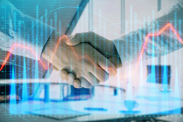 Fototapeta na wymiar Multi exposure of financial graph on office background with two businessmen handshake. Concept of success in business
