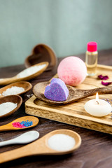 Making fizzing bath bombs at home concept. All the ingredients on table on wood spoons.