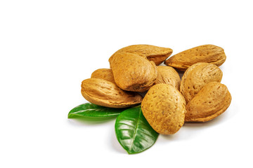 Group of unpeeled almonds on the white background, closeup and isolated.