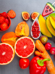 Close up of bright red, orange healthy fruits and vegetables products for Immunity boosting, rich in vitamins and antioxidants, carotenoid, lutein, phosphorus, calcium, Healthy eating concept