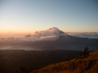 Sunrise, cloud covered mountain