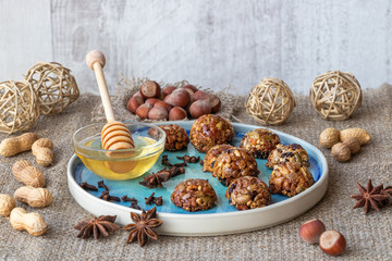 Energy and healthy sweets made from cereals, quinoa, dried nuts, seeds, dried fruits and honey. Cereal crunchy sweet snacks. Homemade useful candies. Raw and vegan sweets.