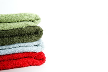 multi-colored terry towels on a white background