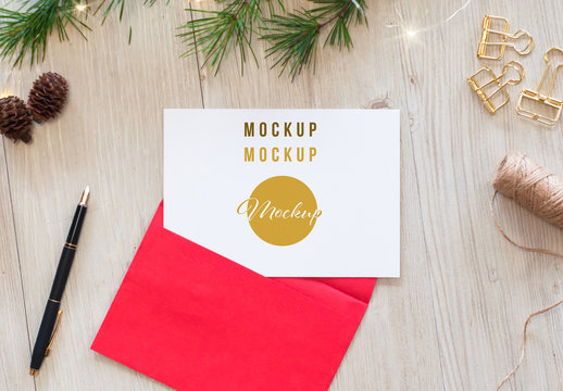 Postcard and Red Envelope Mockup with Christmas Decorations
