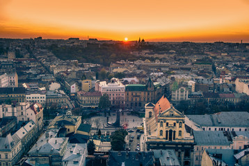 Lviv, Ukraine - October 24, 2019: Lviv old city panorama. Outstanding sunset over the roofs and historical streets. Main square