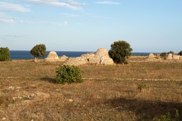 A trullo (plural, trulli) is a traditional Apulian dry stone hut with a conical roof