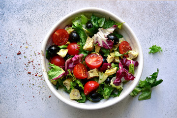 Vegetable salad with grilled chicken. Top view with copy space.