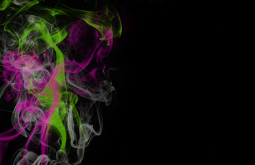 Colorful acid neon green and neon purple smoke on black background with copy space
