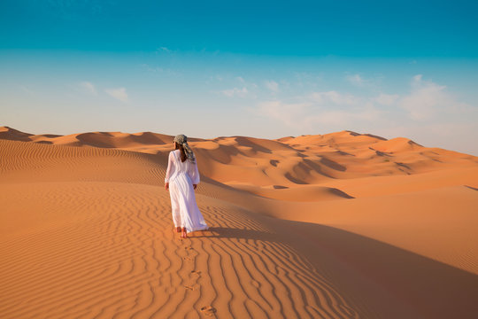 UAE. Woman in desert