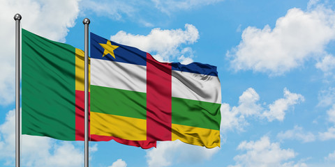 Benin and Central African Republic flag waving in the wind against white cloudy blue sky together. Diplomacy concept, international relations.
