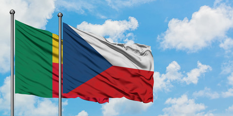 Benin and Czech Republic flag waving in the wind against white cloudy blue sky together. Diplomacy concept, international relations.