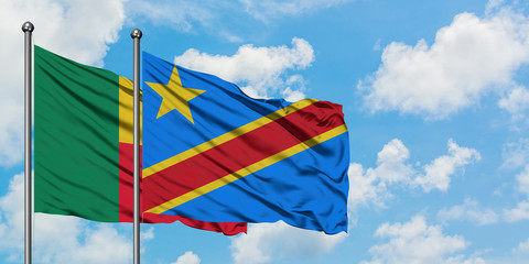 Benin and Congo flag waving in the wind against white cloudy blue sky together. Diplomacy concept, international relations.