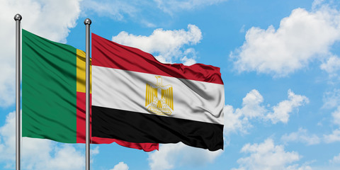 Benin and Egypt flag waving in the wind against white cloudy blue sky together. Diplomacy concept, international relations.