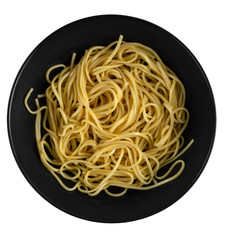 yellow yakisoba noodles in black matte plate isolated on a white background, top view