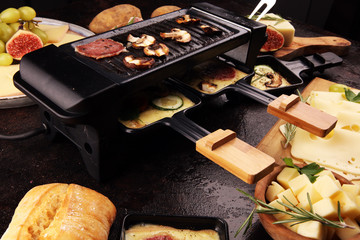 Delicious traditional Swiss melted raclette cheese on diced boiled or baked potato.