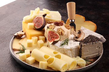 Different sorts of cheese. Cheese platter with different cheese and spice