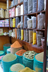 Oriental spices and seasonings in transparent package on shelves of shop