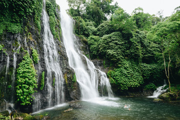 Fototapeta na wymiar Beautiful waterfall of Bali island in Indonesia