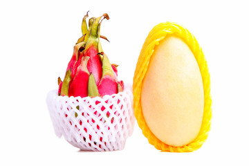 Ripe mango and pitahaya in a grid
