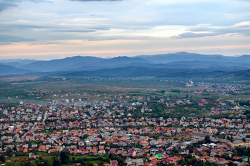 Fototapeta na wymiar Top view on the evening city of Khust, Transcarpathia Ukraine