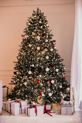 artificial Christmas tree decorated for the holiday in one style