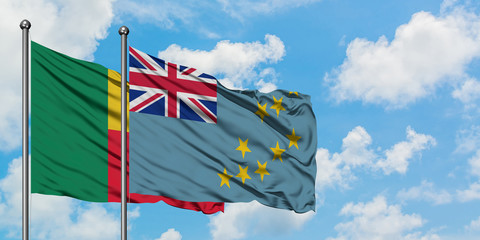 Benin and Tuvalu flag waving in the wind against white cloudy blue sky together. Diplomacy concept,...