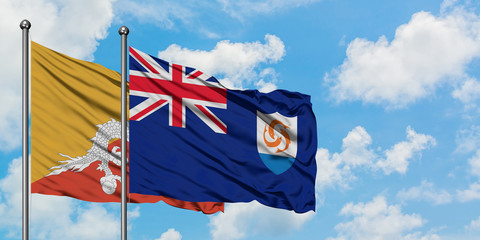 Bhutan and Anguilla flag waving in the wind against white cloudy blue sky together. Diplomacy concept, international relations.