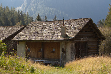 Obraz premium mountain Landscape with old houses in Bregaglia, Switzerland in autumn