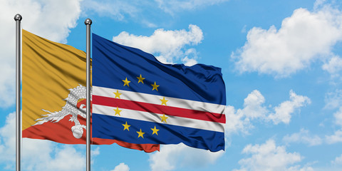 Bhutan and Cape Verde flag waving in the wind against white cloudy blue sky together. Diplomacy concept, international relations.