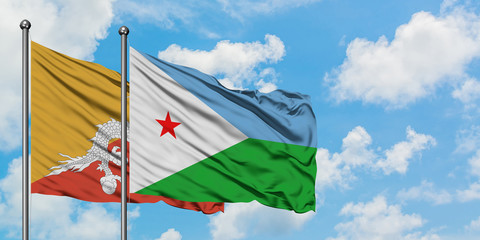 Bhutan and Djibouti flag waving in the wind against white cloudy blue sky together. Diplomacy concept, international relations.