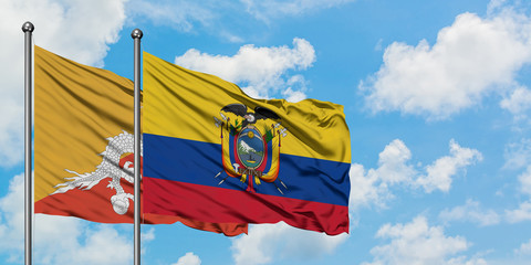 Bhutan and Ecuador flag waving in the wind against white cloudy blue sky together. Diplomacy concept, international relations.