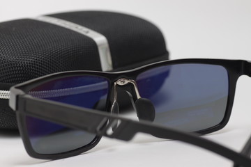 Black sunglasses on a white background