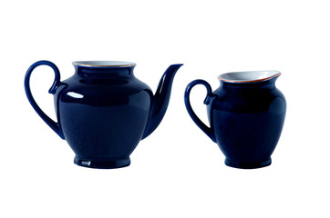Blue teapot and milk jug with handle. Isolated objects on a white background. Tea ceremony.