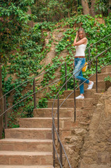 Woman descending a staircase on a park in Barcelona