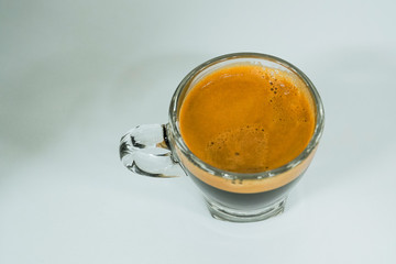 an espresso in a shot glass